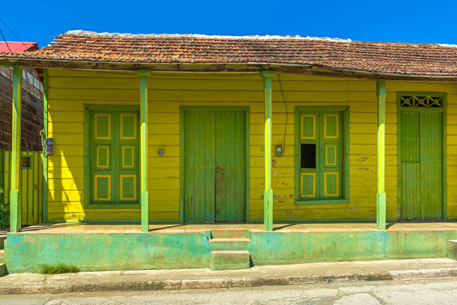 Old, yellow building in Baracoa, Cuba