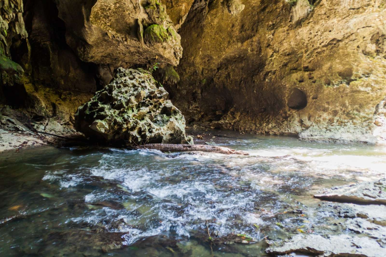 River running through cave at Candelaria, Guatemala