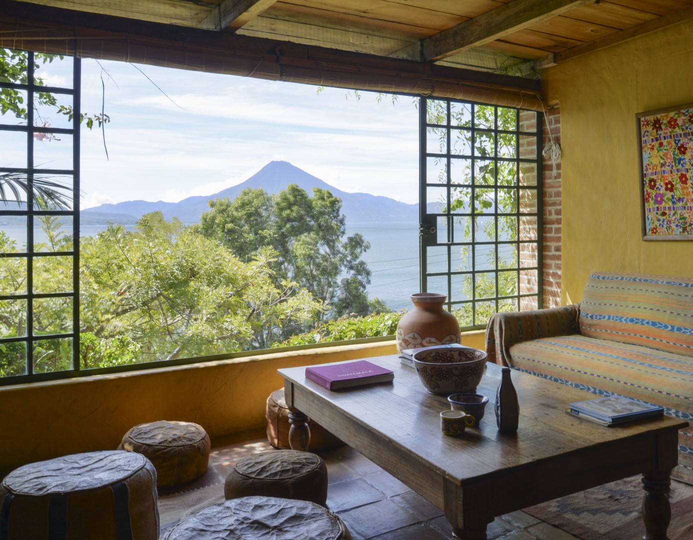 Indoor seating area with volcano view at Casa Palopo in Lake Atitlan