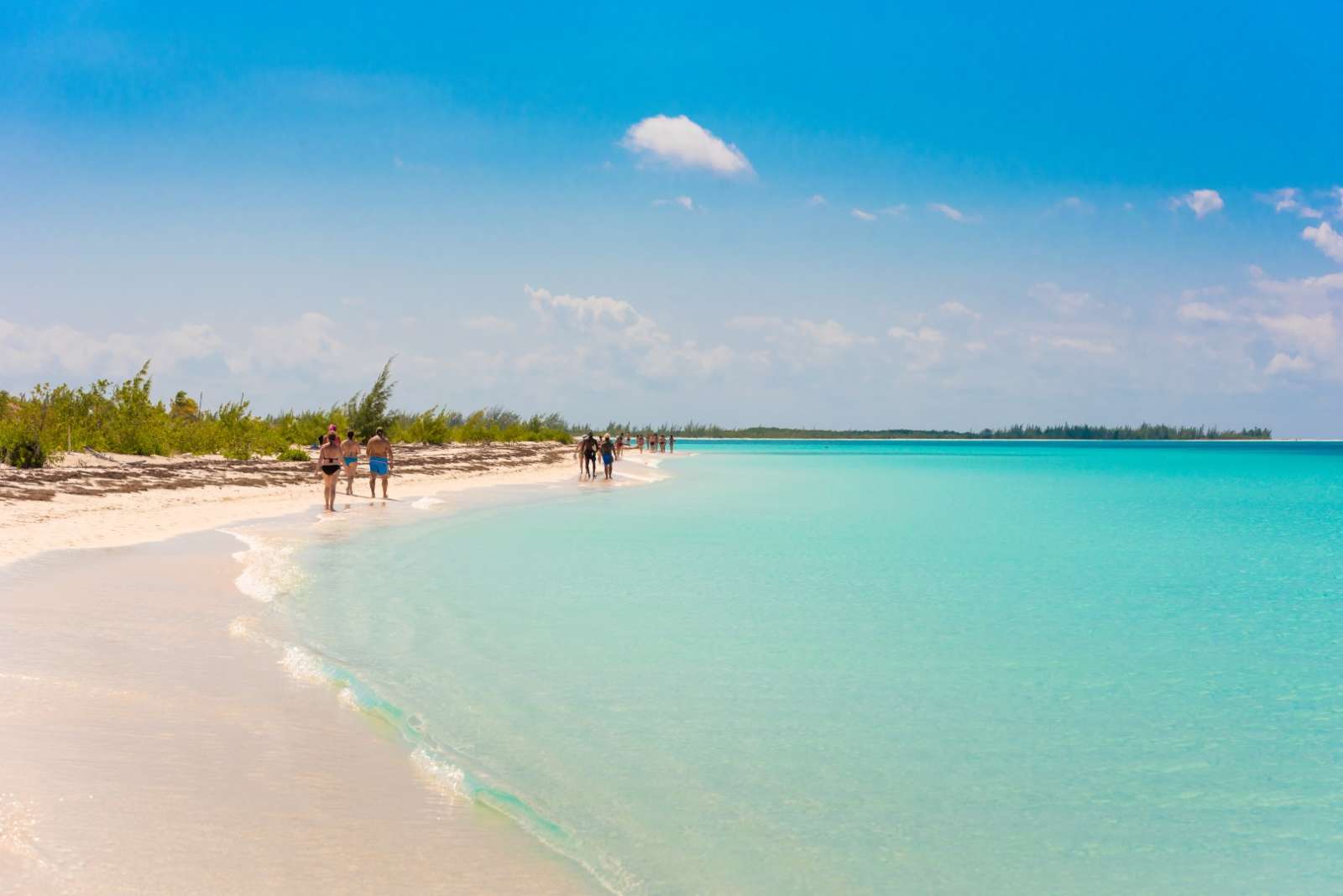 People walking along the beach at Cayo Largo, Cuba