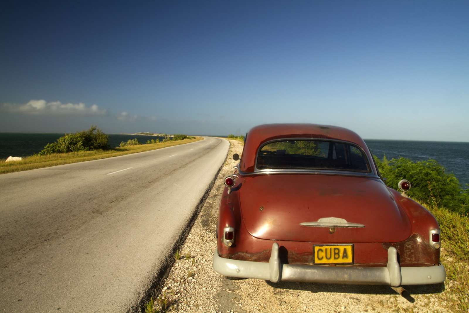 Classic car on the causeway to Cayos de Villa Clara, Cuba