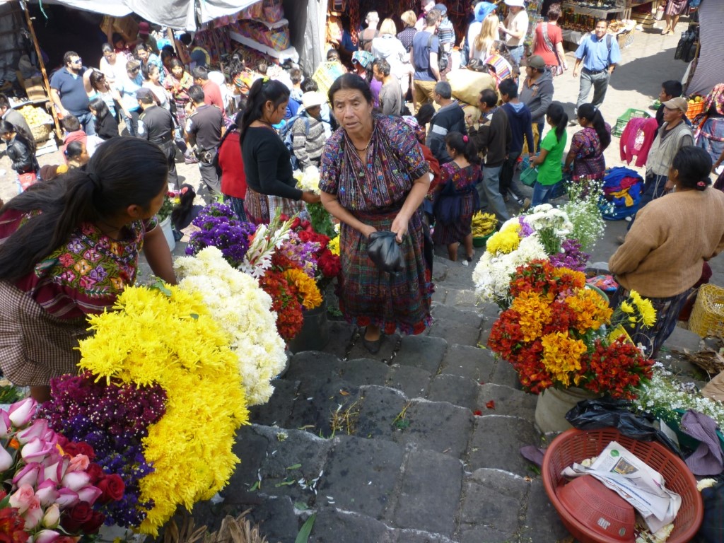 Selling flowers on the church steps at Chichicastenango, Guatemala