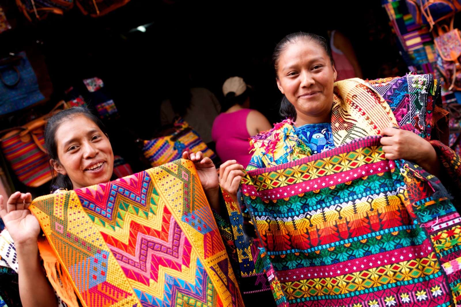 Two lady traders selling colourful throws at Chichicastenango, Guatemala