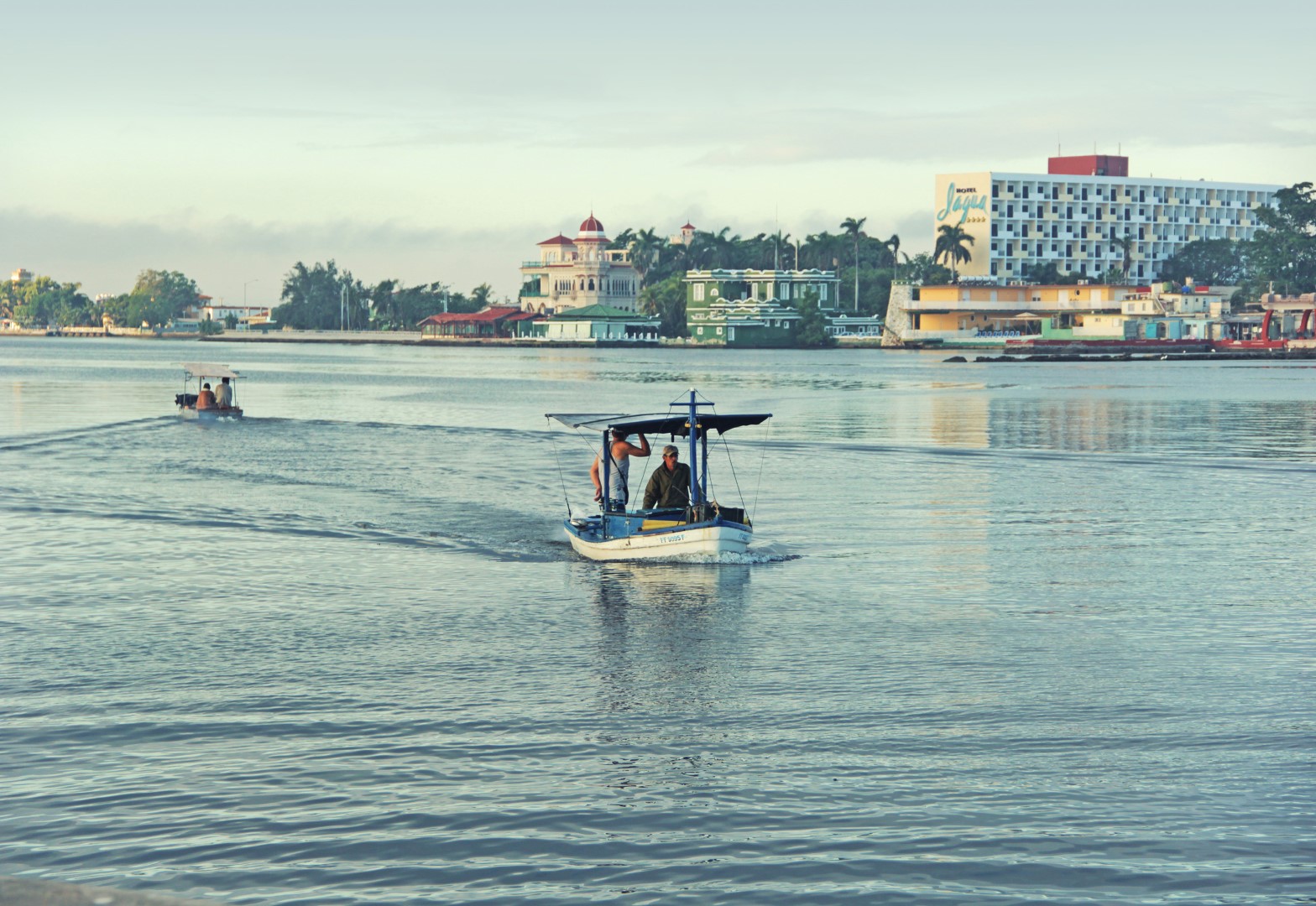 Small boat crossing Cienfuegos Bay