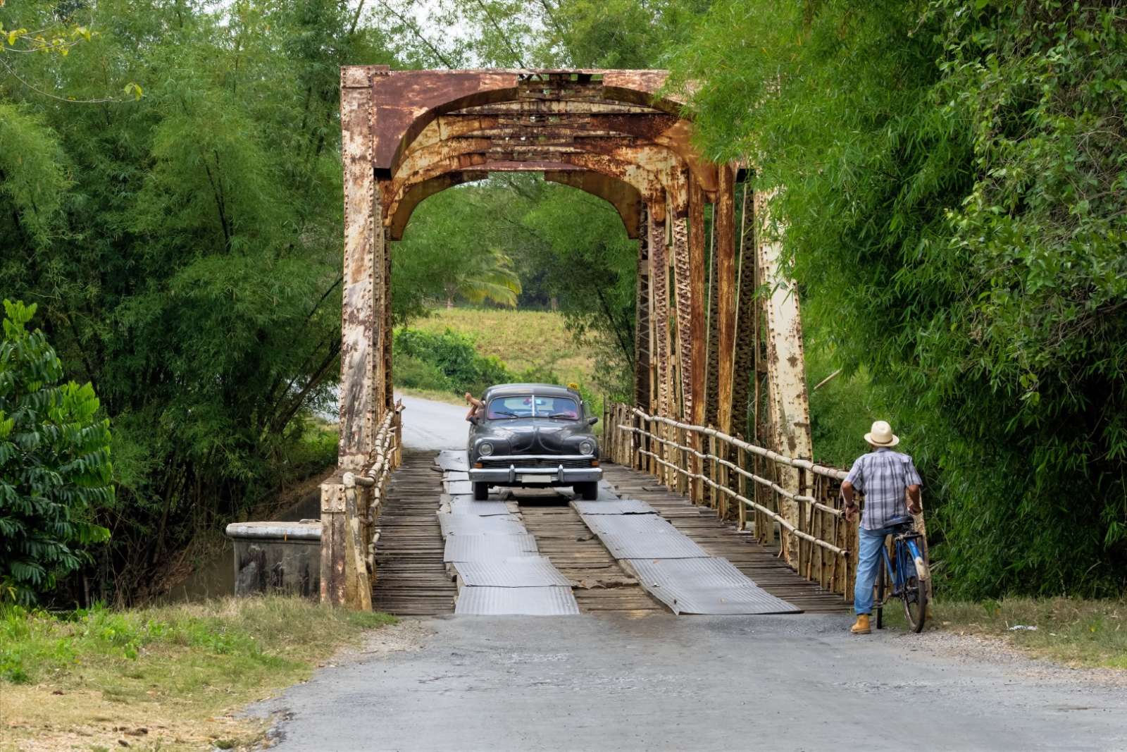 Car driving over a bridge in Vinales Cuba