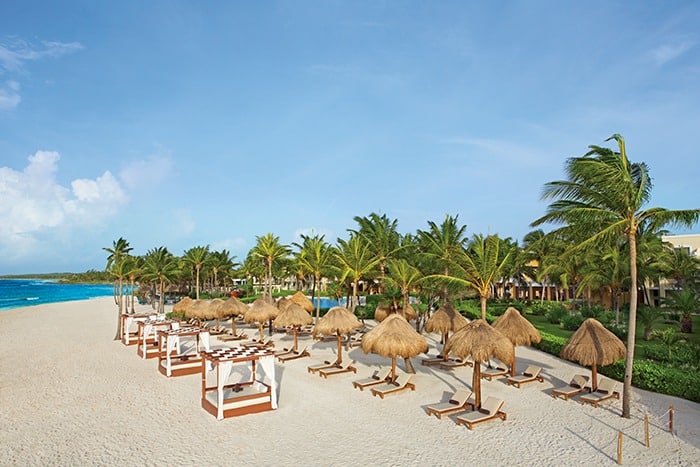 Deckchairs on beach at Dreams Tulum