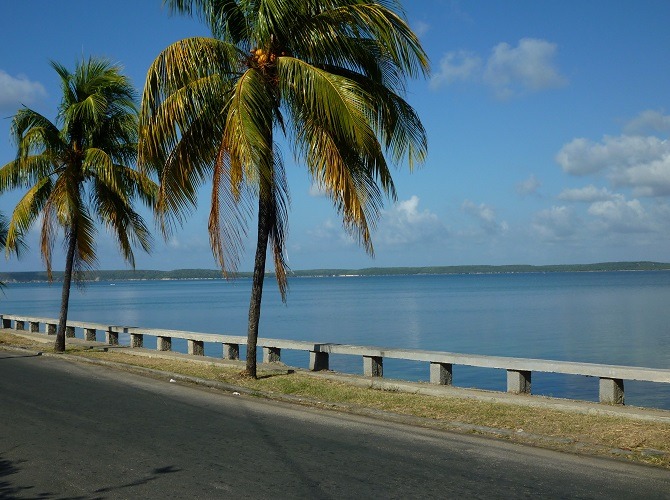 A road running alongside the Bay of Cienfuegos