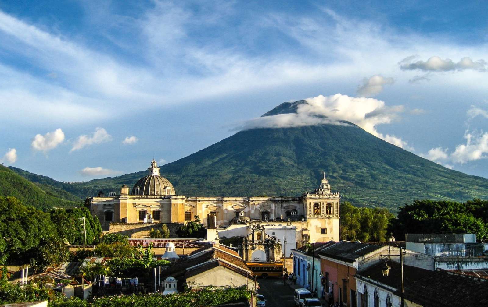 Rooftops of Antigua in Guatemala with volcano in background