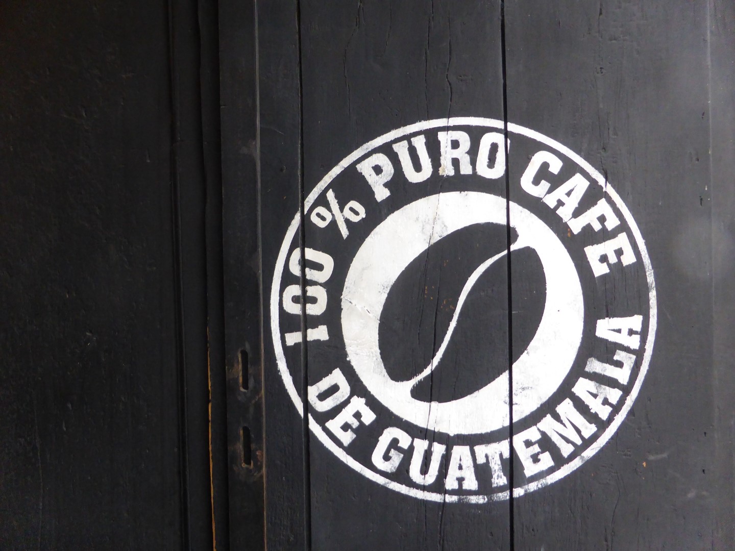 Sign on door advertising Guatemalan coffee