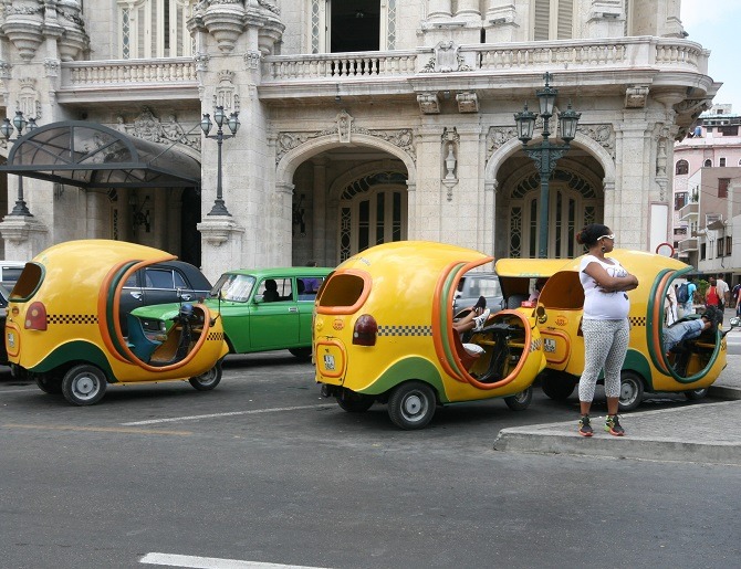 Yellow, auto rickshaws in Old Havana, Cuba