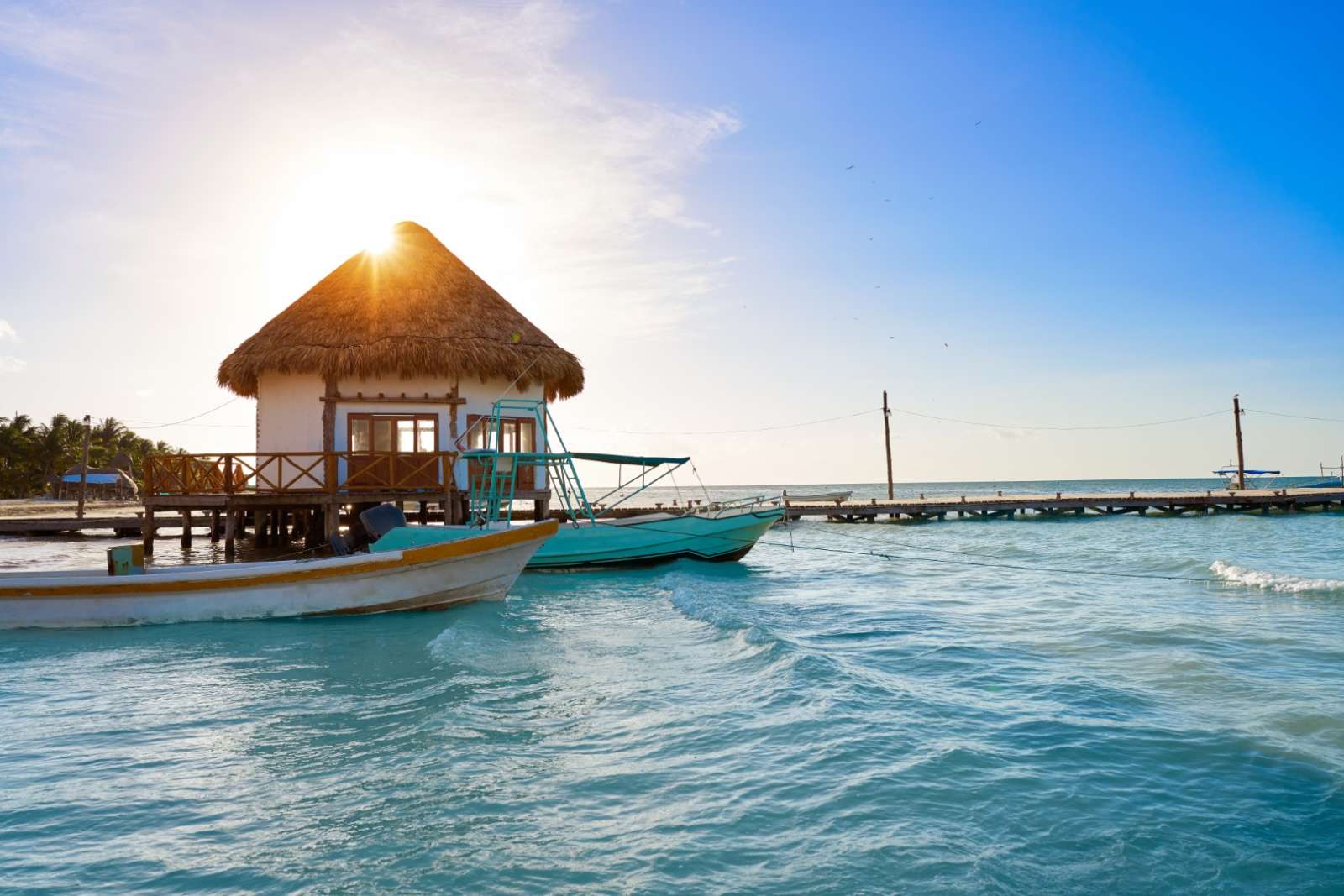 Boats alongside pier in Holbox, Mexico