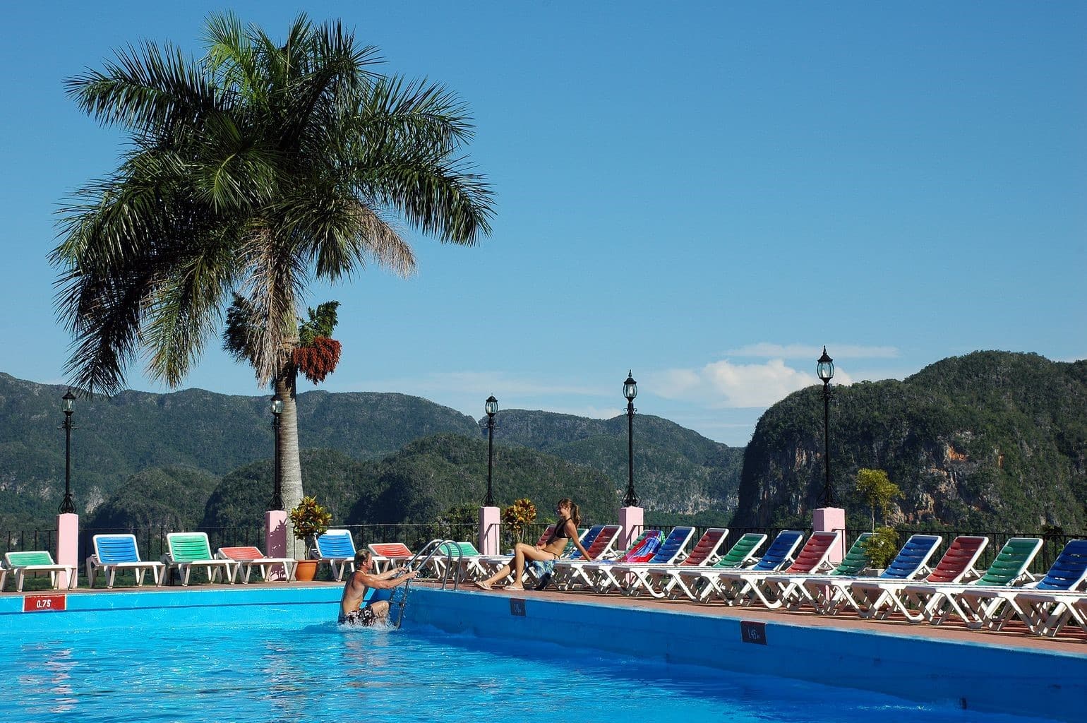 Man getting out of pool at Hotel Los Jazmines in Vinales, Cuba