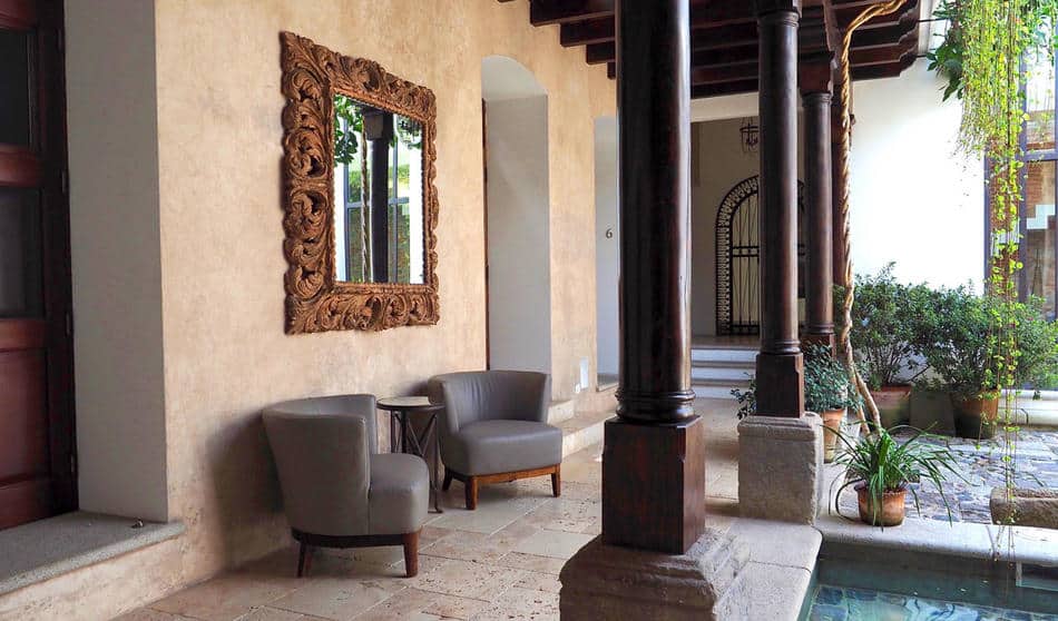 Seating by pond at Hotel San Rafael in Antigua