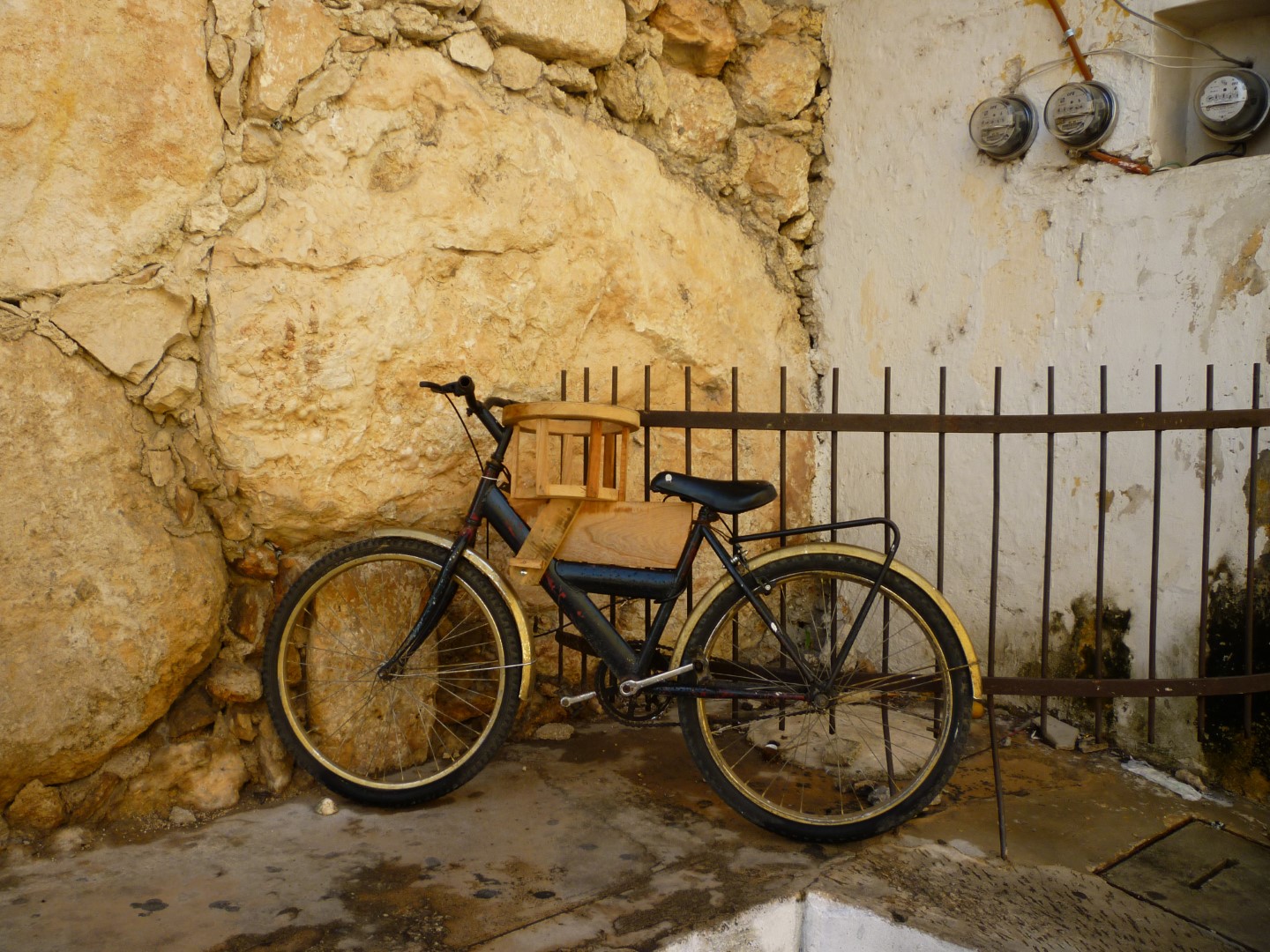 Bike against railing in Izamal Mexico