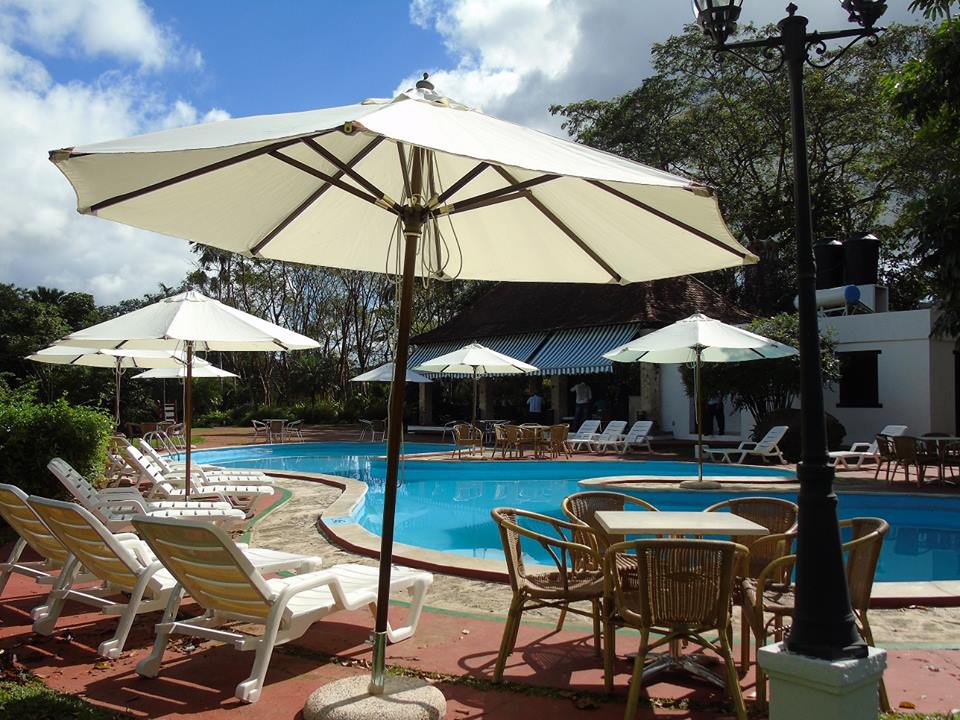 Umbrellas at the swimming pool of La Moka hotel in Las Terrazas, Cuba