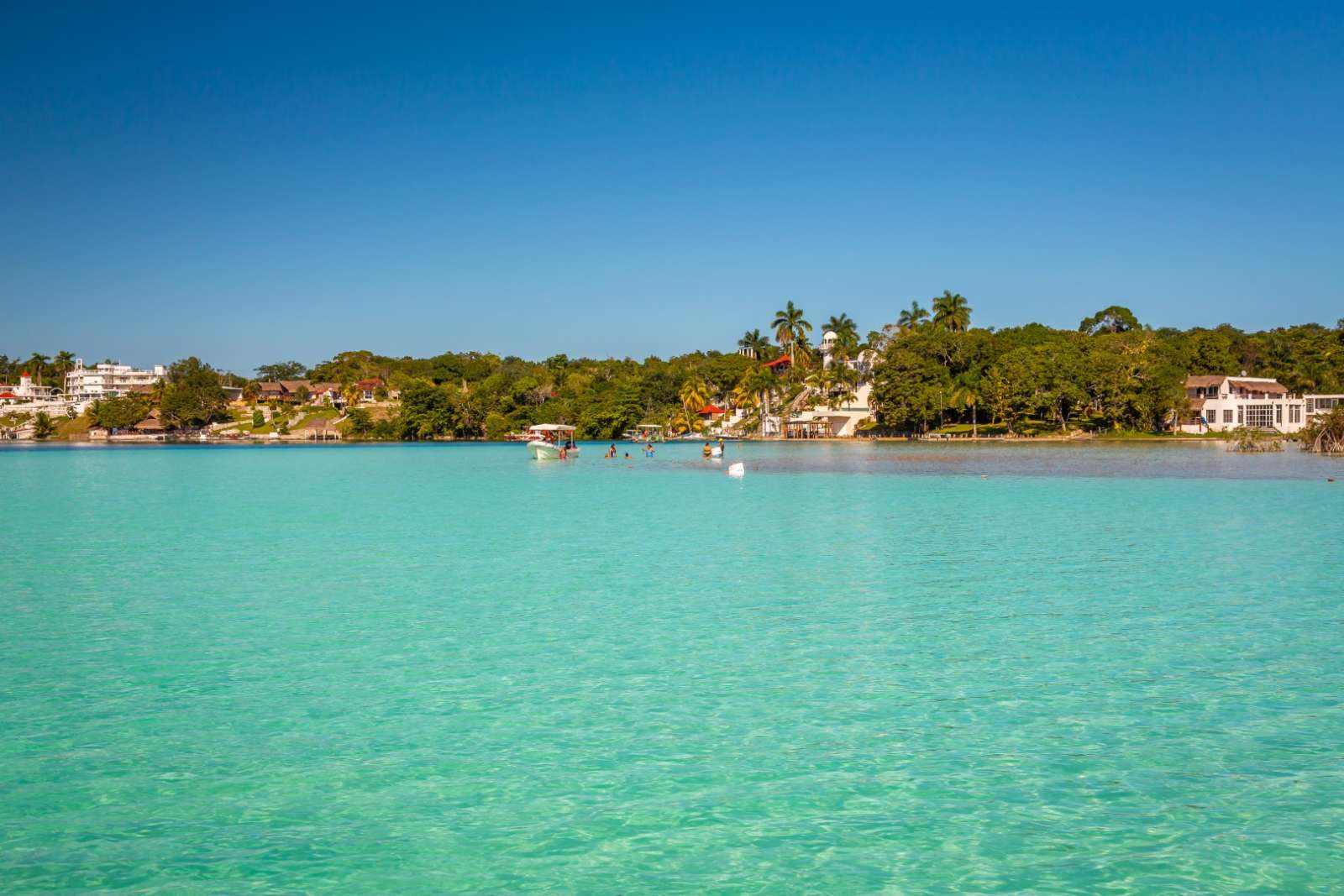 Family swimming in Laguna Bacalar