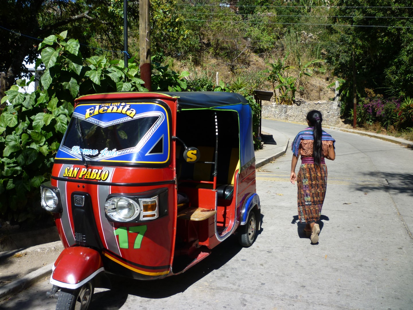 Rickshaw and Mayan woman Lake Atitlan, Guatemala