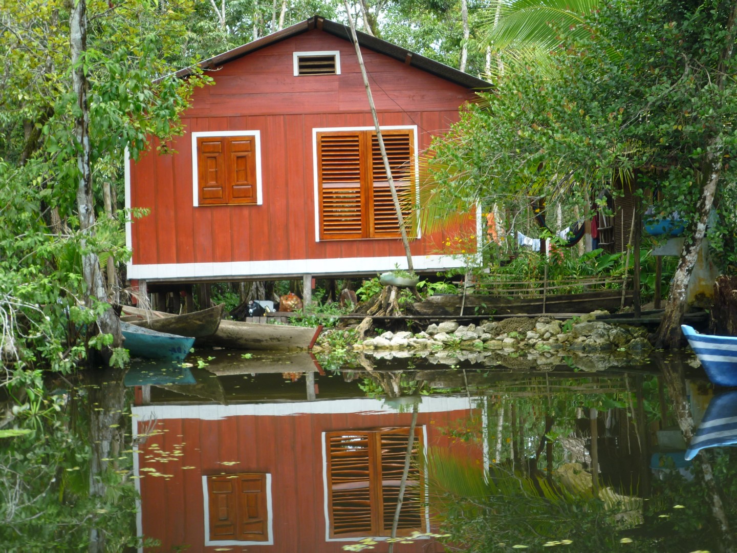 A traditional riversidee house on the Rio Dulce near Livingston, Guatemala