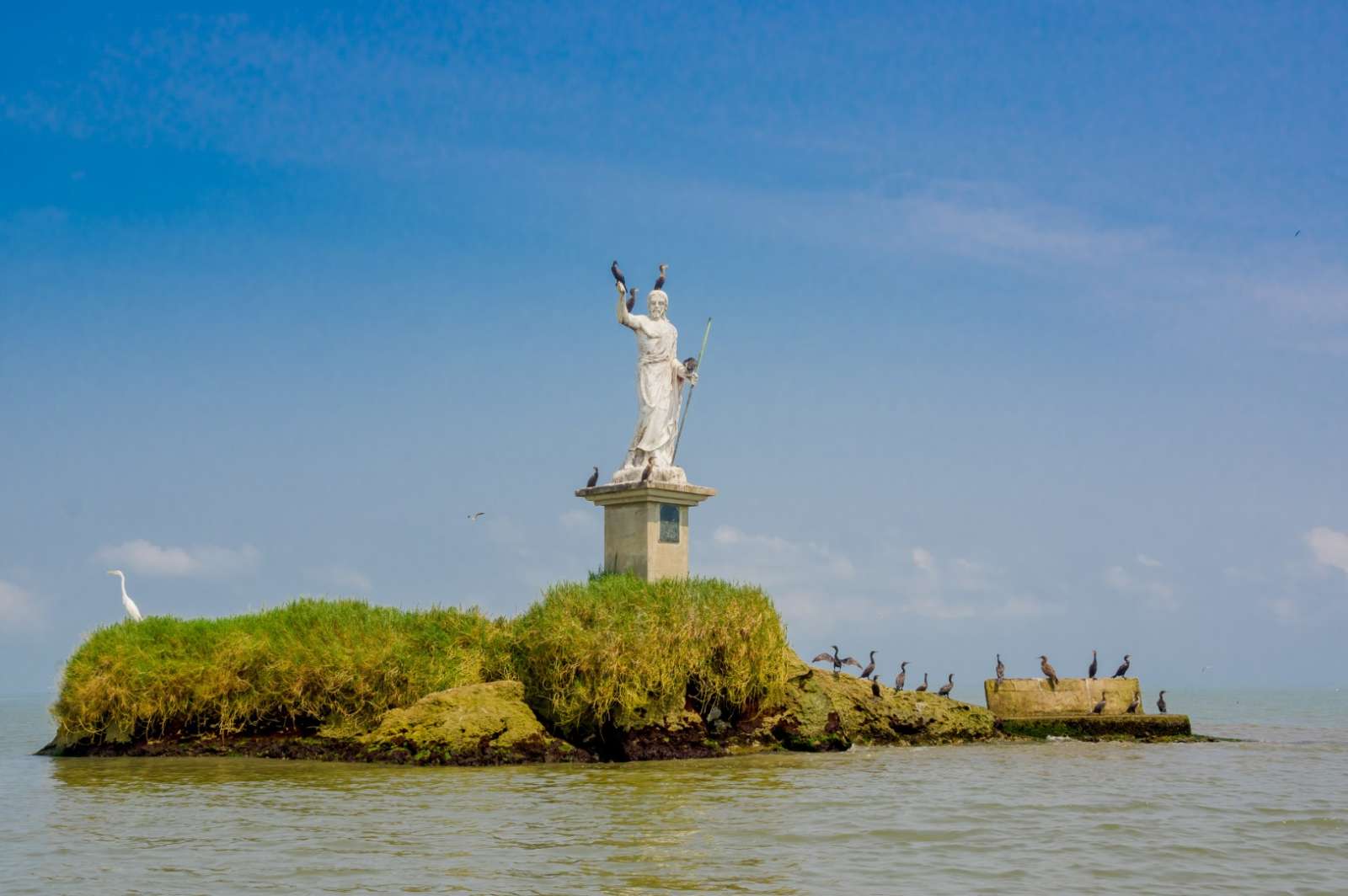 Statue at sea in Livingston, Guatemala