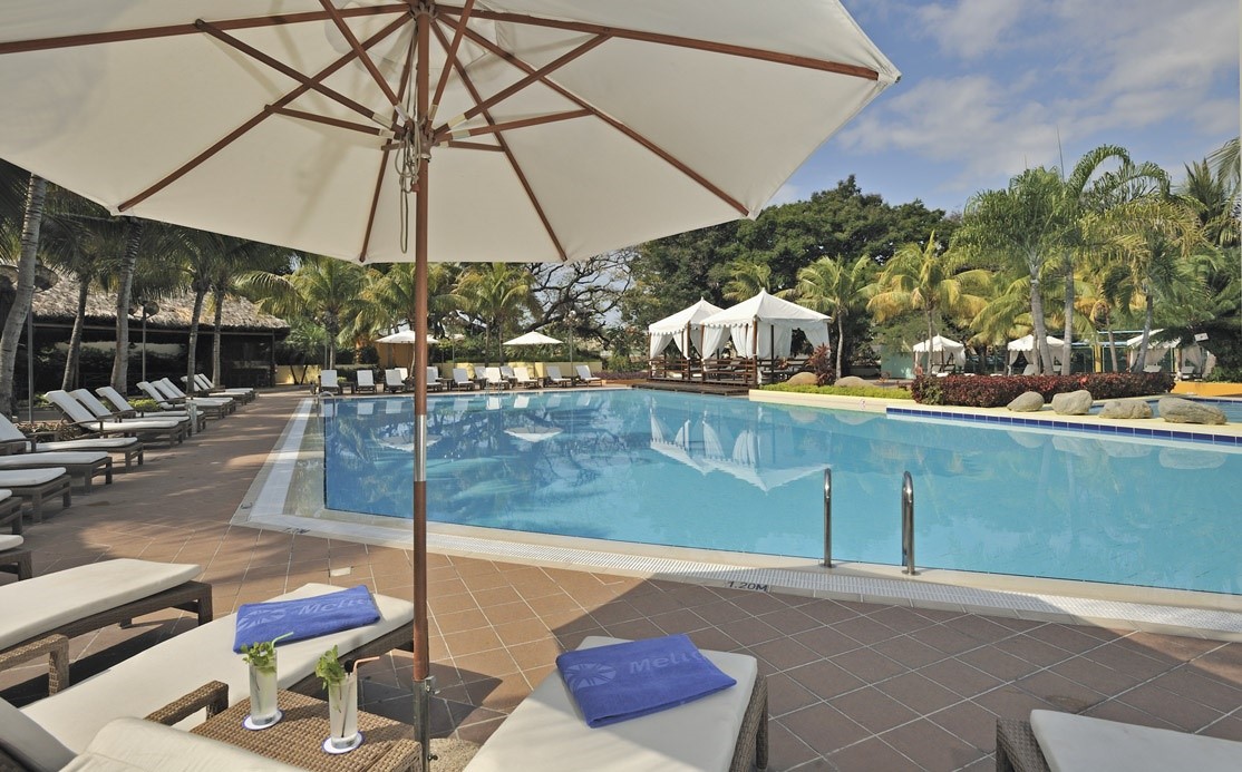 Umbrella at swimming pool of Melia Santiago