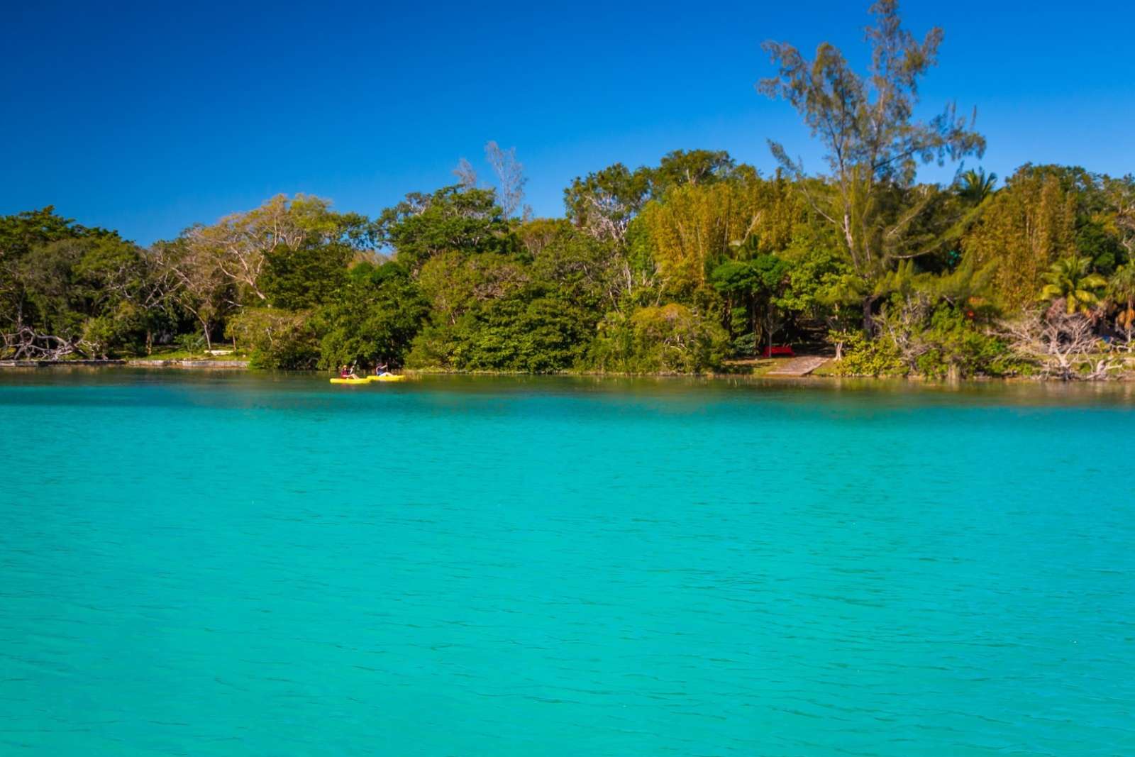 Couple kayaking on Laguna Bacalar in Mexico