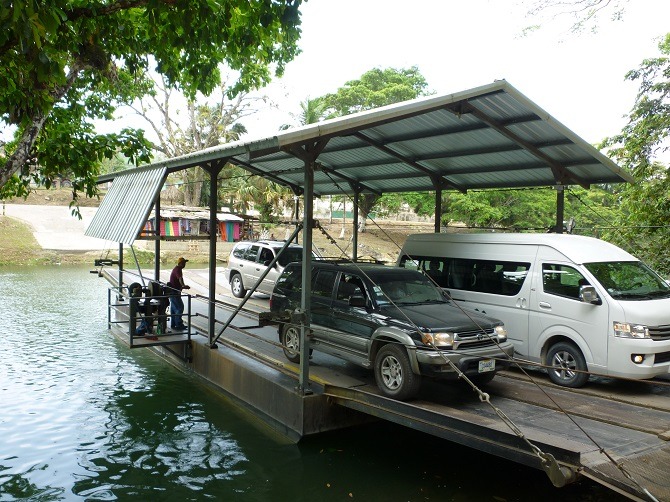 Cars crossing the Mopan River in San Ignacio, Belize