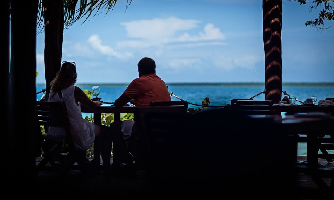 Couple viewing lake at Rancho Encantado Bacalar