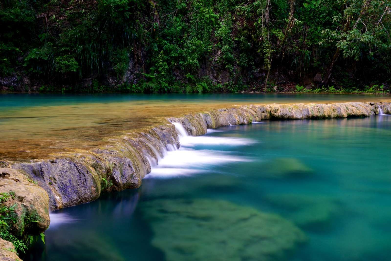 Smooth waterfall at Semuc Champey in Guatemala