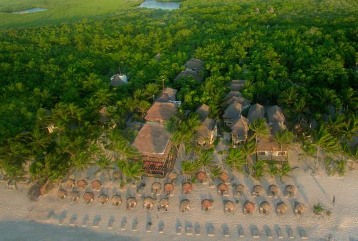 Aerial shot of a small beach hotel in Tulum, Mexico