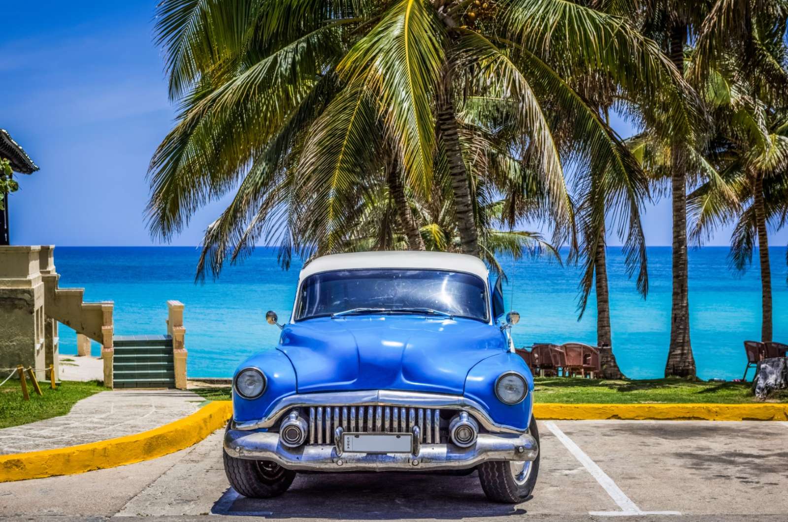 Classic car in front of Varadero beach, Cuba