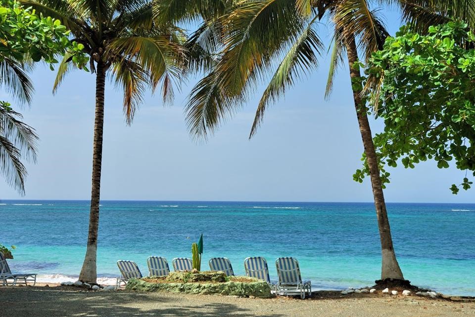 Deckchairs facing out to sea at Villa Maguana