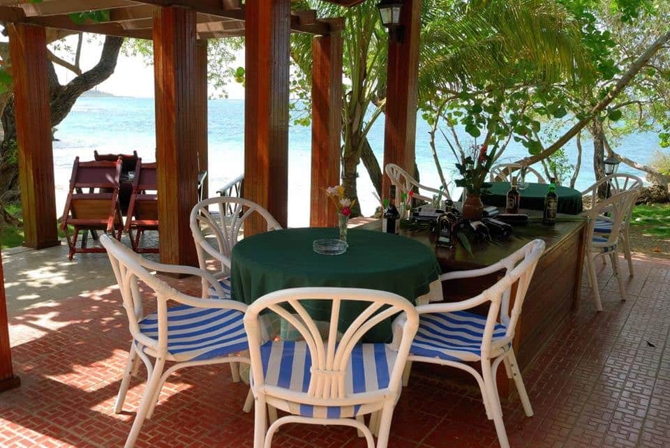 Table and chairs with seaview at Villa Maguana