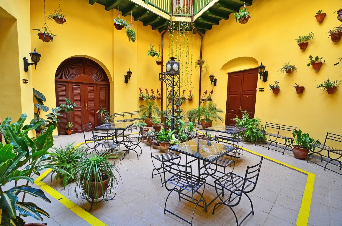 Tables laid out in the patio at Camino de Hierro