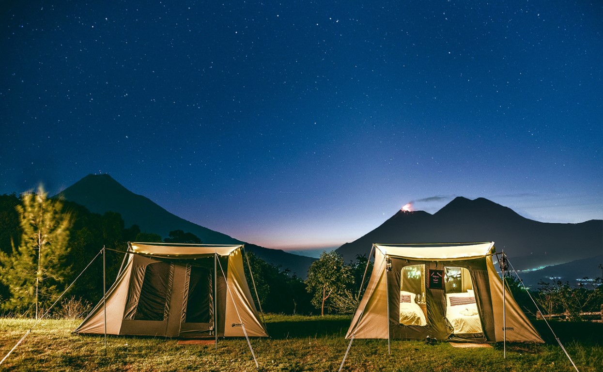 Tents set against the night sky