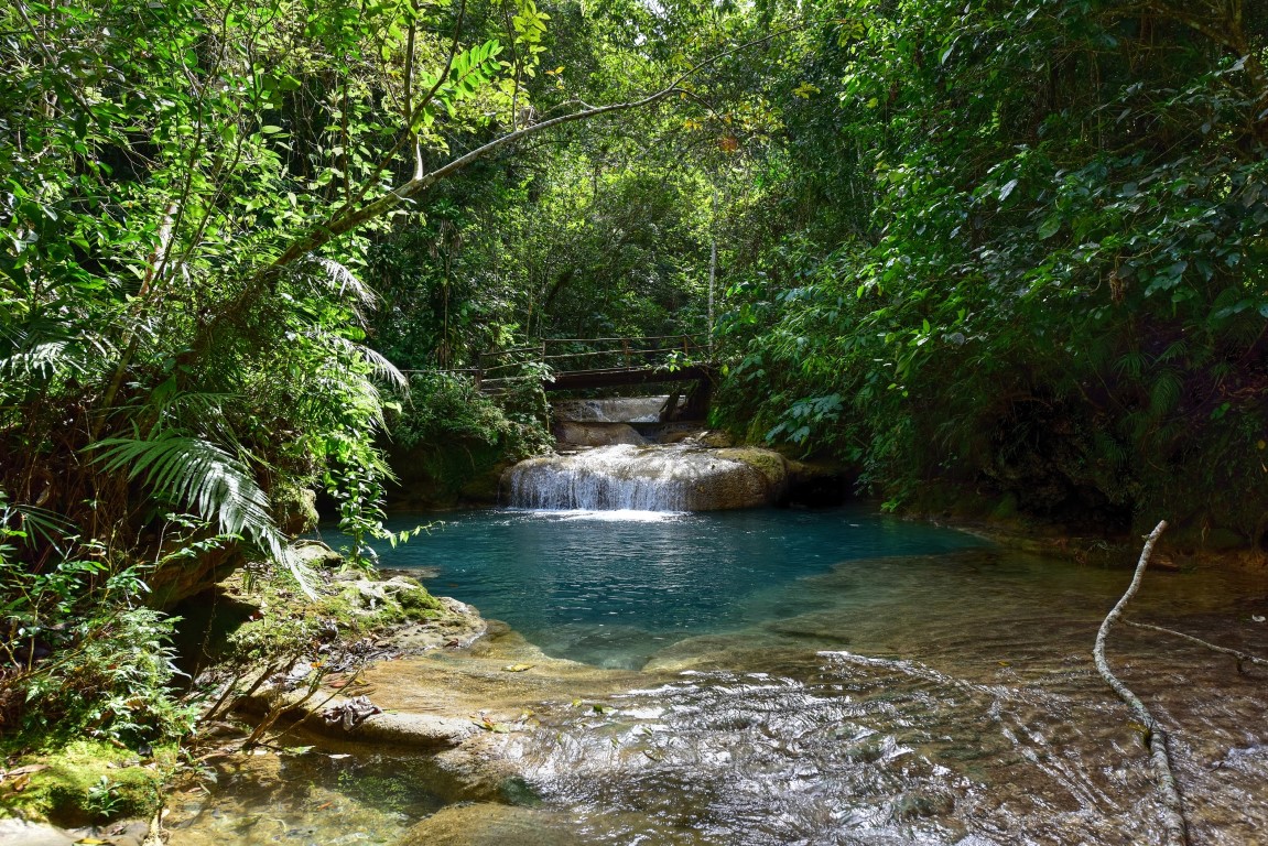 Hiking past waterfalls in Guanayara Park