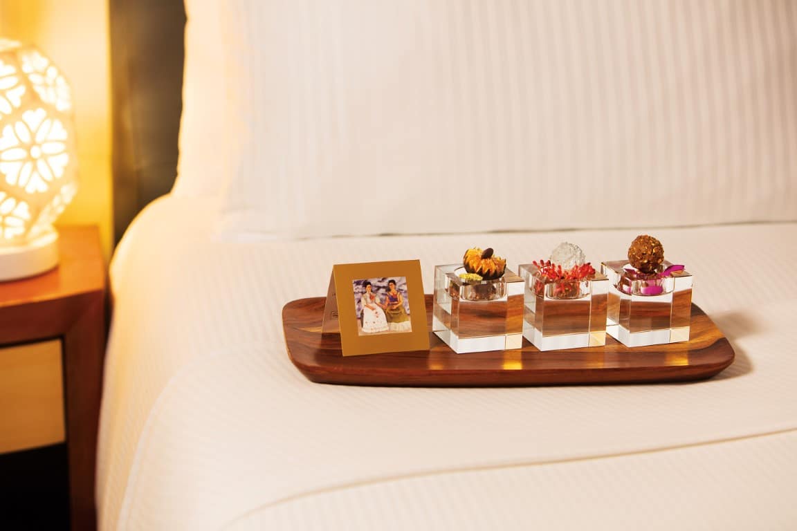 Chocolates on bed at Zoetry Villa Rolandi