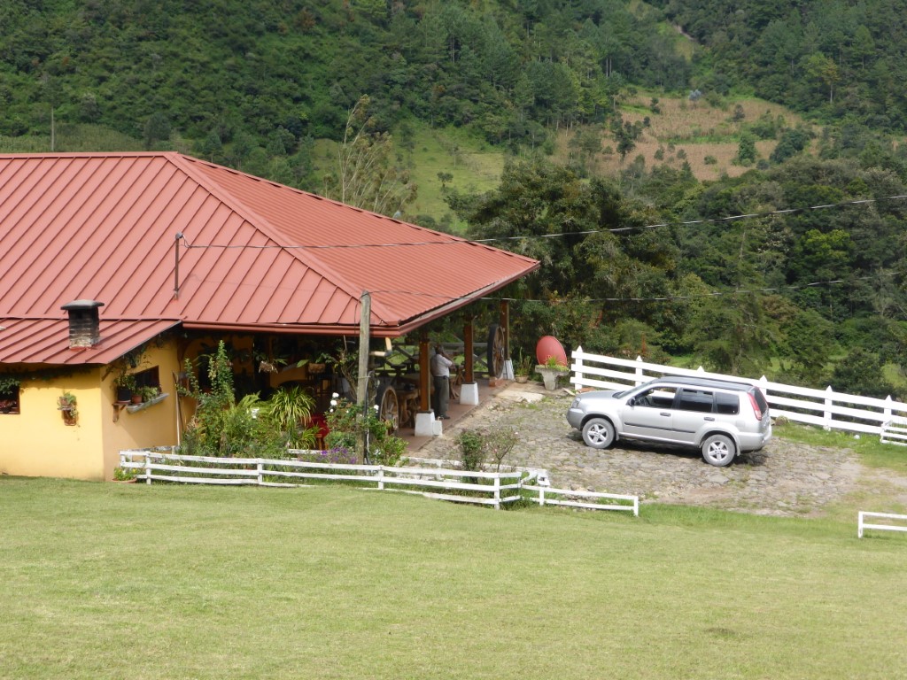 Driver stood by his car in the Guatemala Highlands