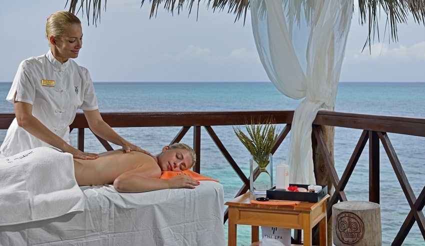 Woman having a massage by the sea