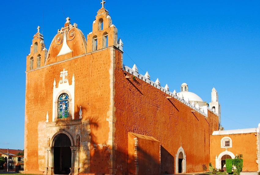 Small, orange church with bell tower