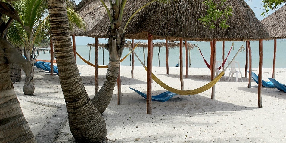 Beach with palapas and hammocks