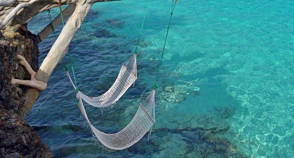 Hammocks over the sea in Cuba