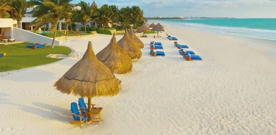 Palapas and beach beds on Playa Maroma Mexico