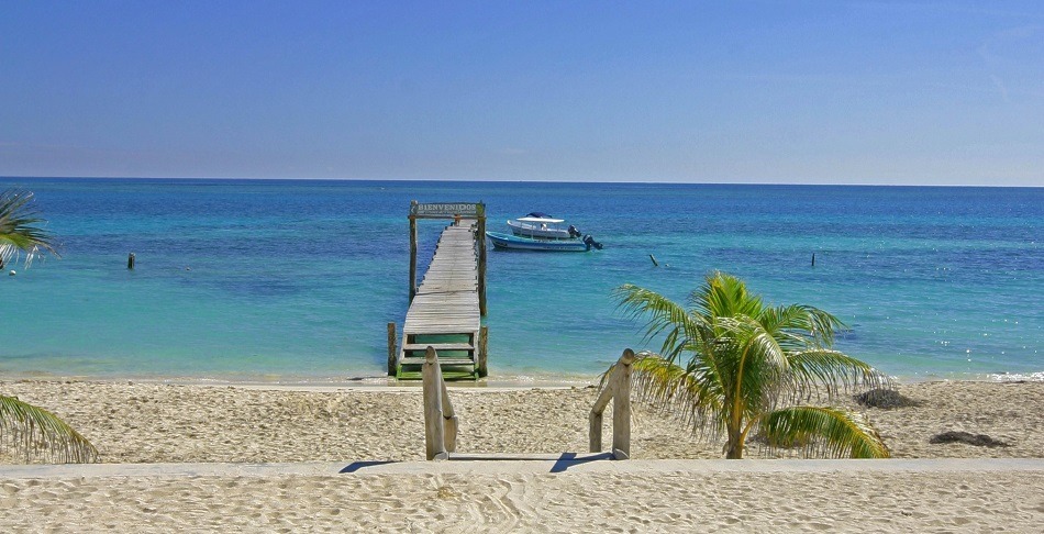 Jetty and boat in Puerto Morelos Mexico