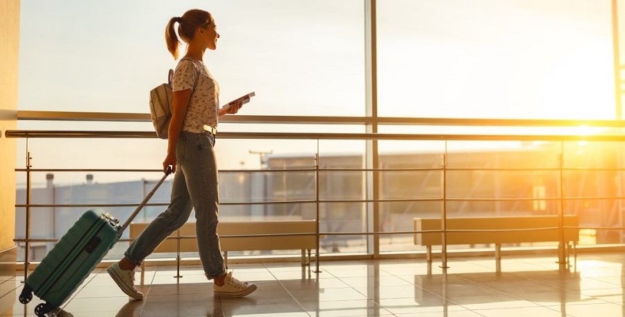 Woman at airport with suitcase