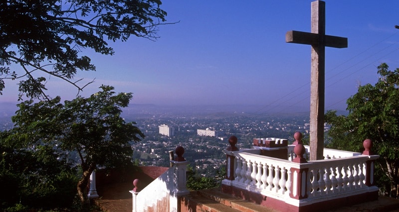 Cross at top of a hill with panoramic views