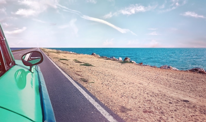 Driving along a causeway in Cuba