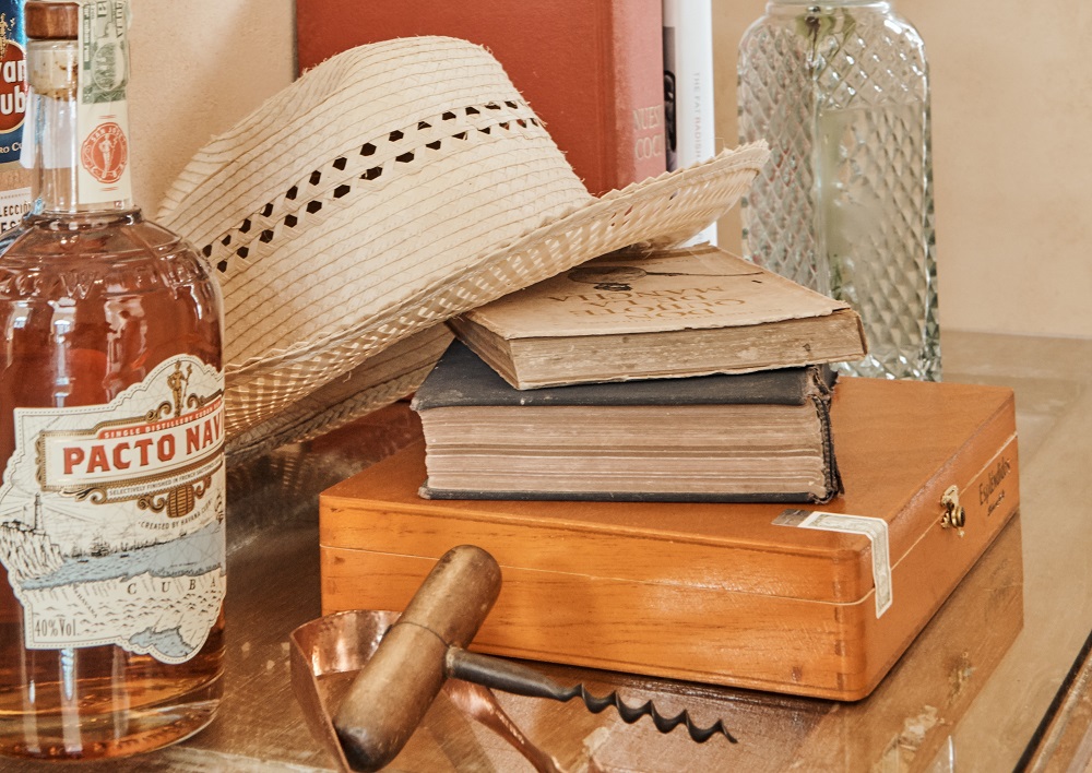 Rum, cigars, hat & books in Cuba