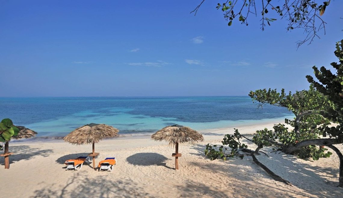 Beautiful Cuban beach with parasols