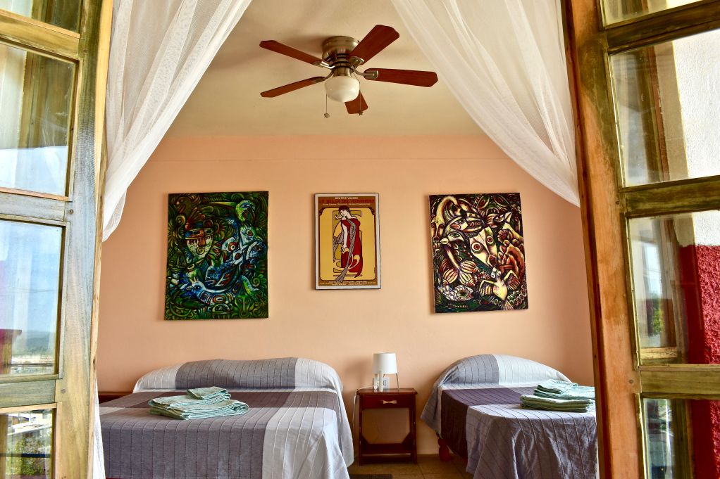 Cuban art on bedroom wall