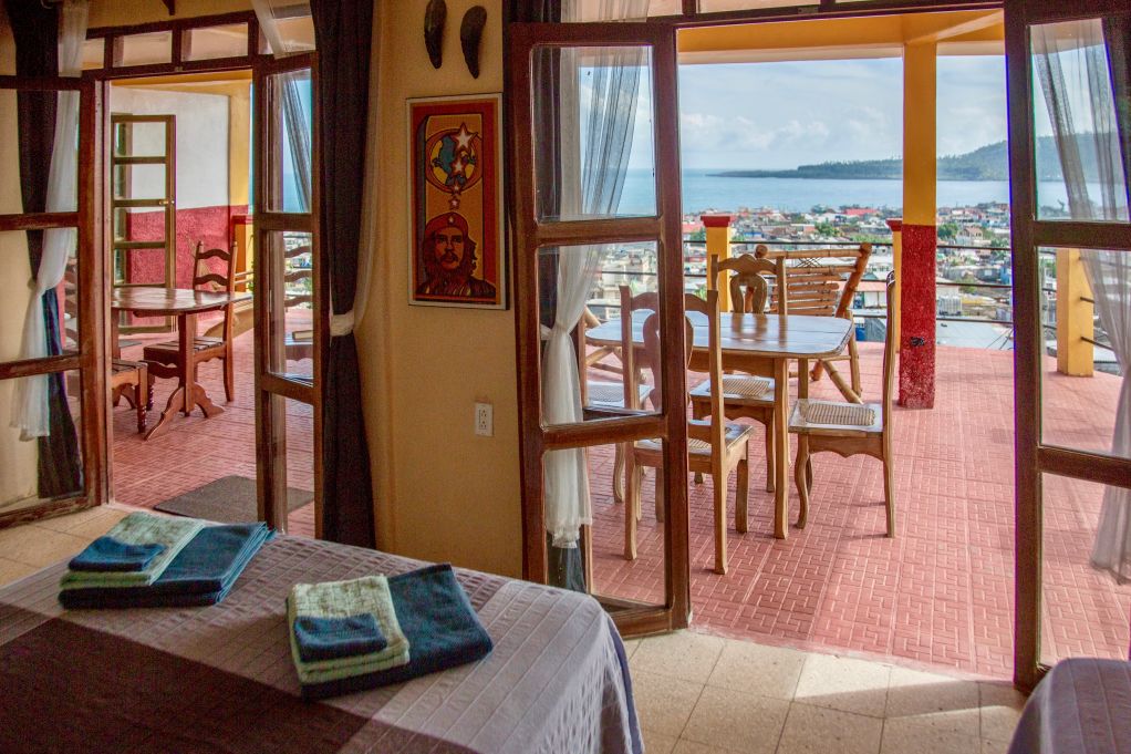 Terrace with tables and chairs overlooking Baracoa